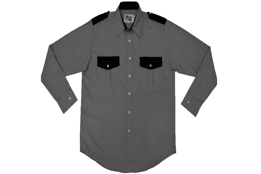 CAMISA GRIS OXFORD CON TAPAS Y HOMBRERAS NEGRAS MANGA LARGA